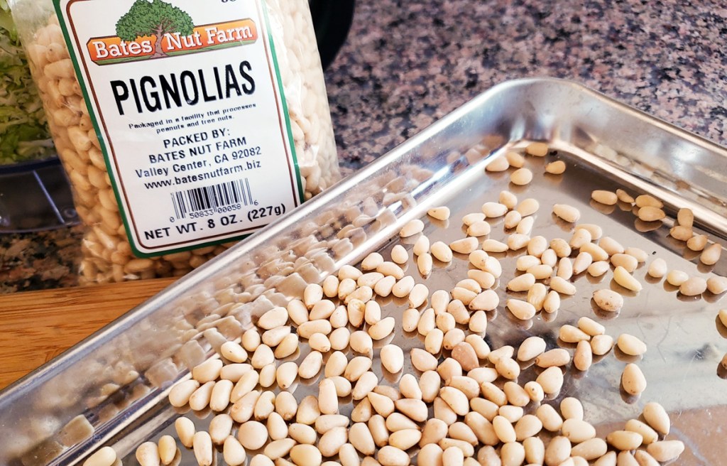 pine nuts on baking sheet