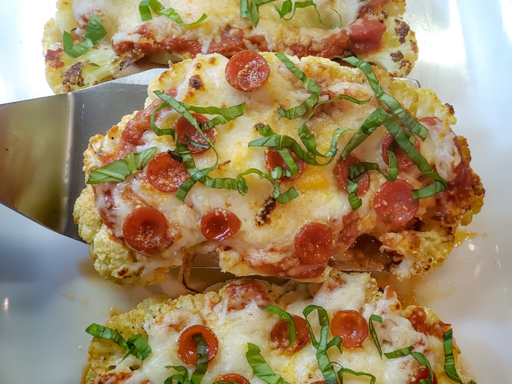 keto cauliflower parm being plated