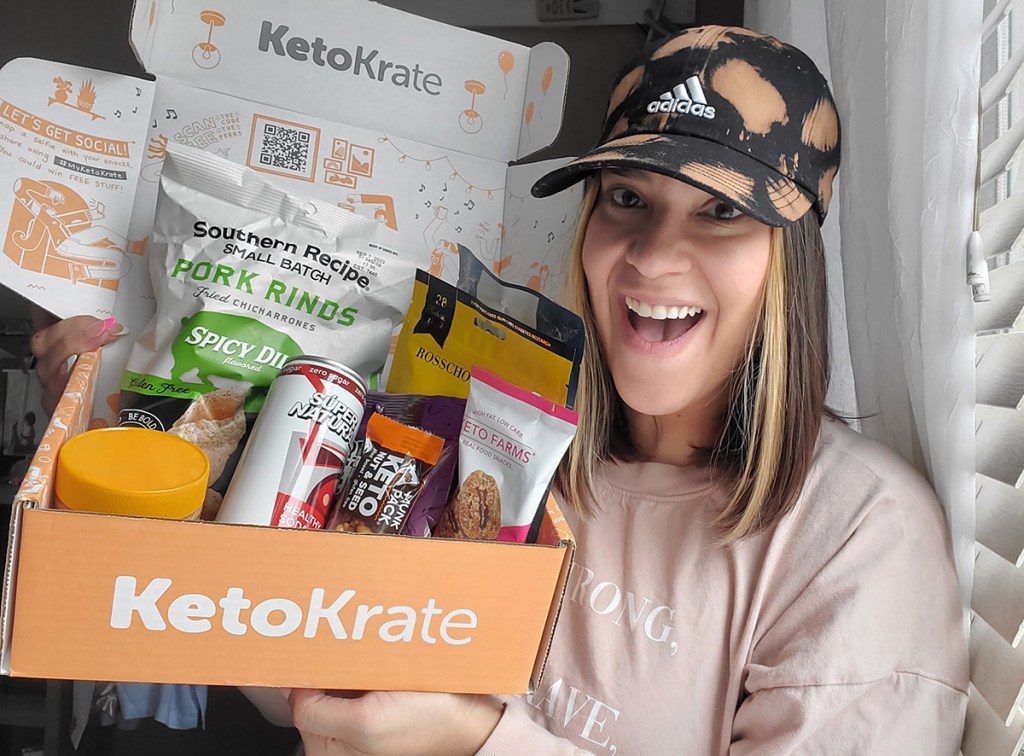 woman holding keto krate box with keto snacks