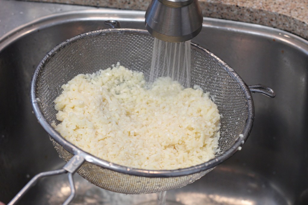 rinsing palmini low carb rice in sink