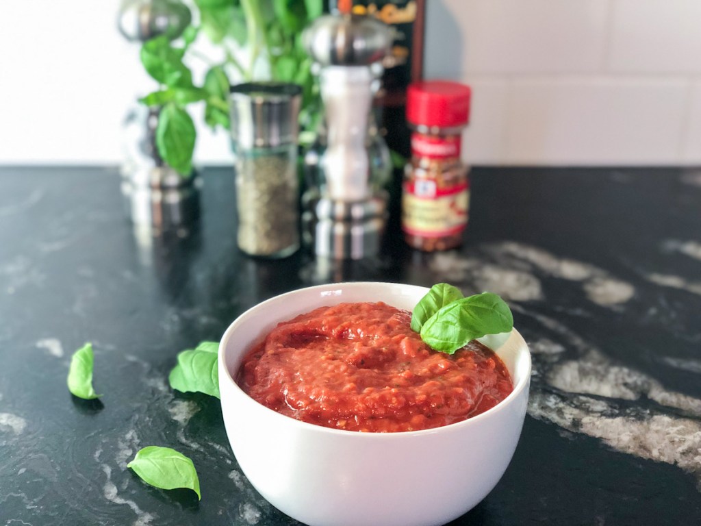 keto marinara sauce in a bowl with ingredients