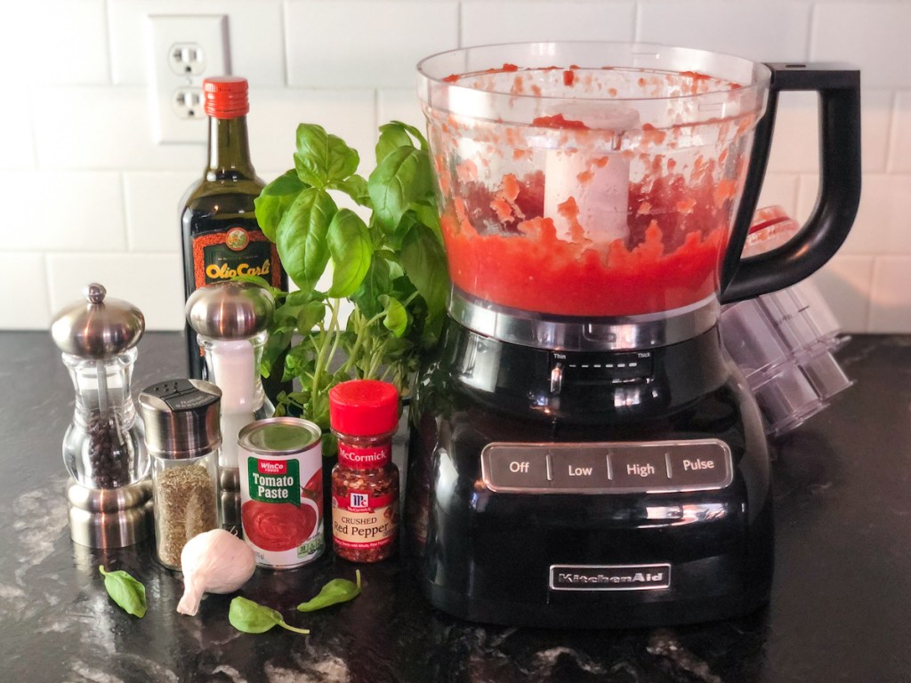 blended tomatoes next to marinara ingredients 