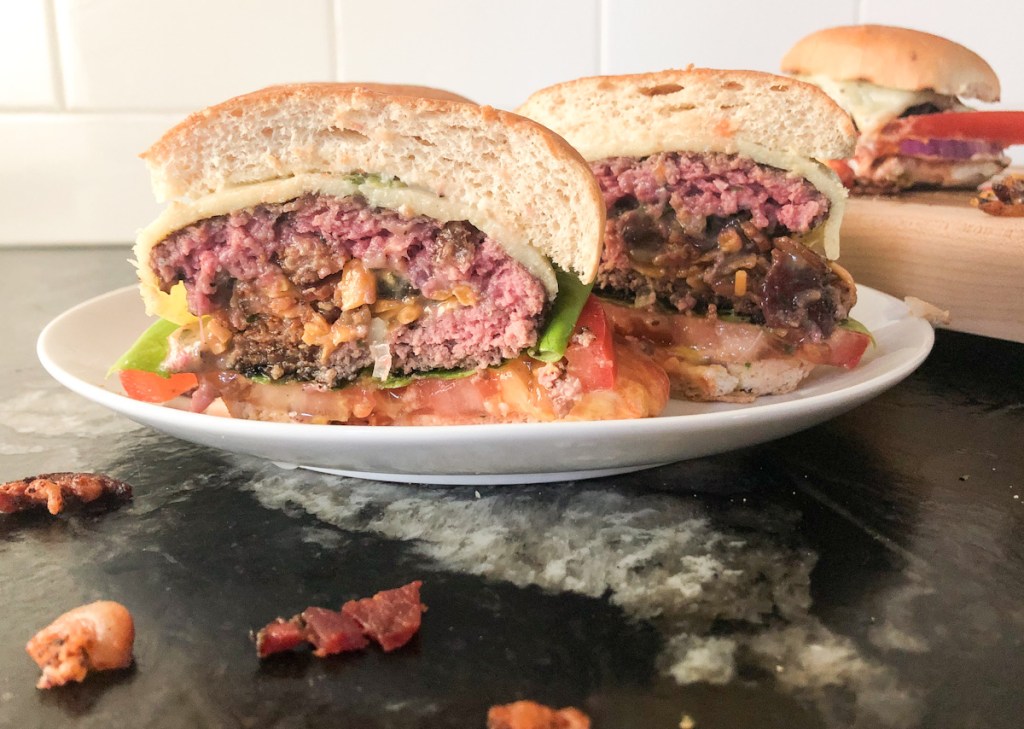 burger cut in half on a plate