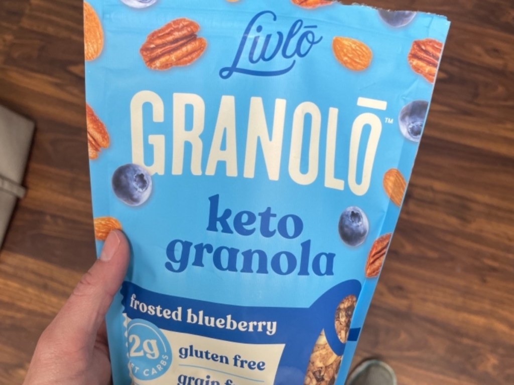 holding bag of keto granola