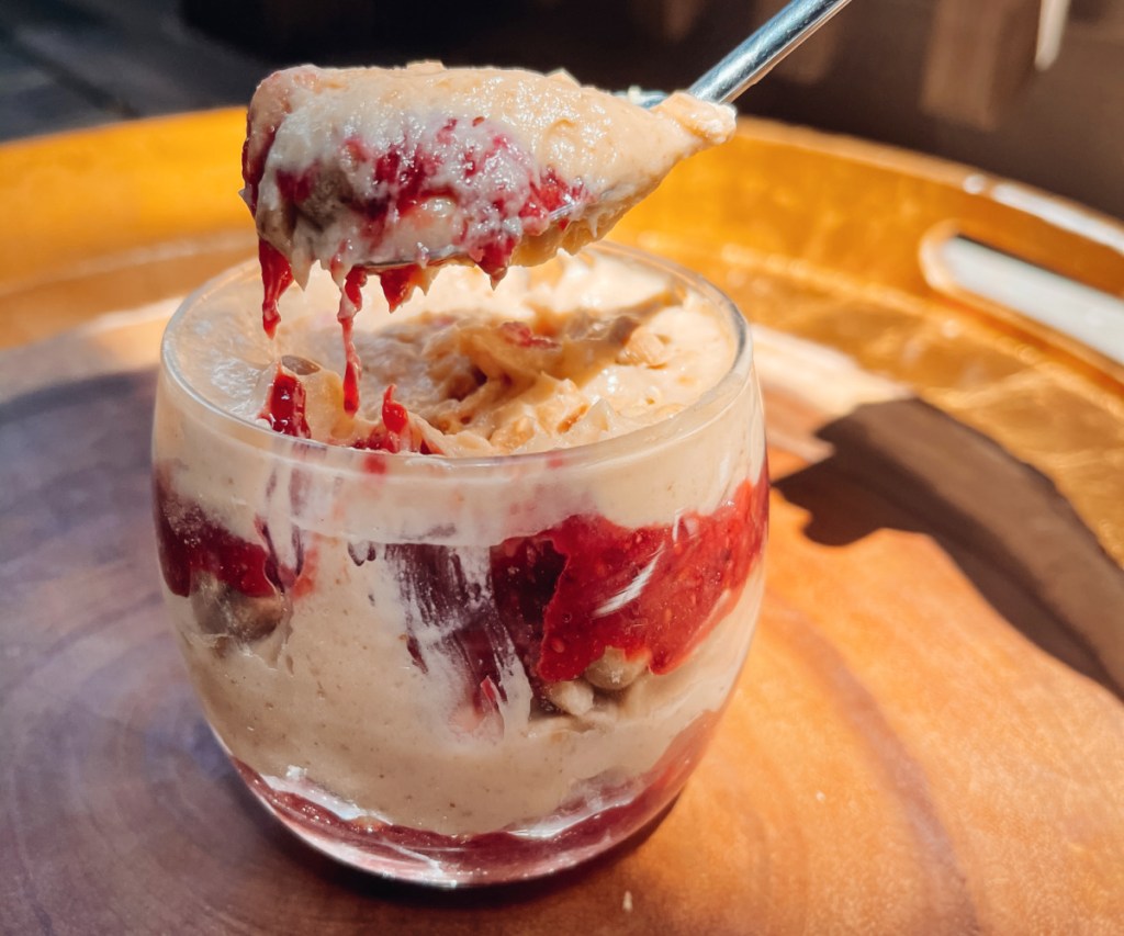 scooping peanut butter mousse with jelly on spoon