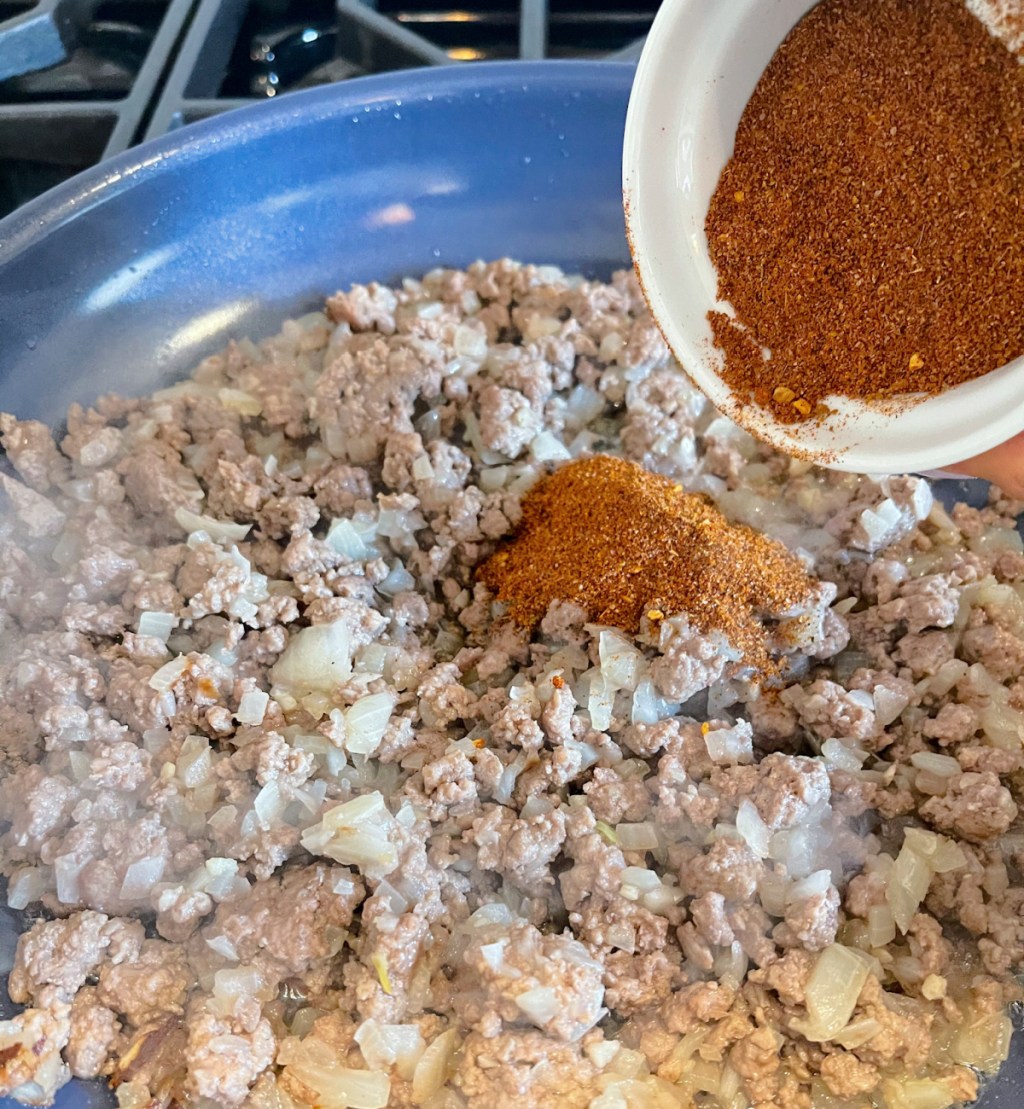 adding in keto taco seasoning