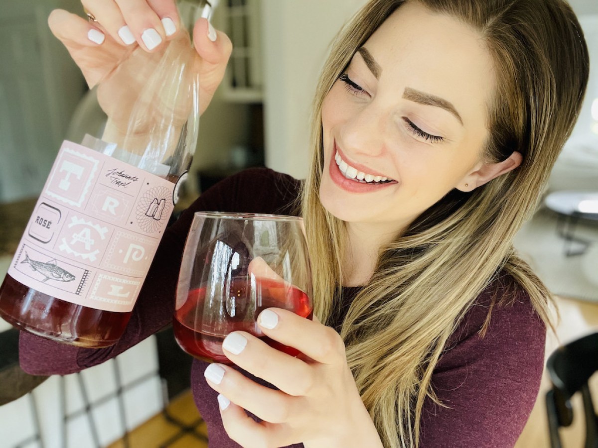 woman holding red wine