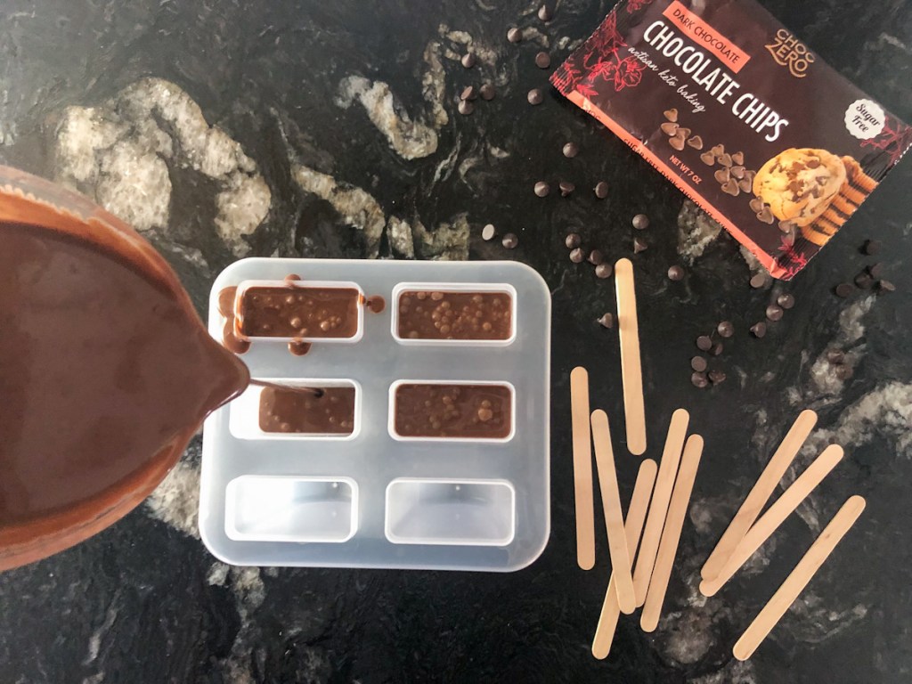 pouring chocolate mixture into molds