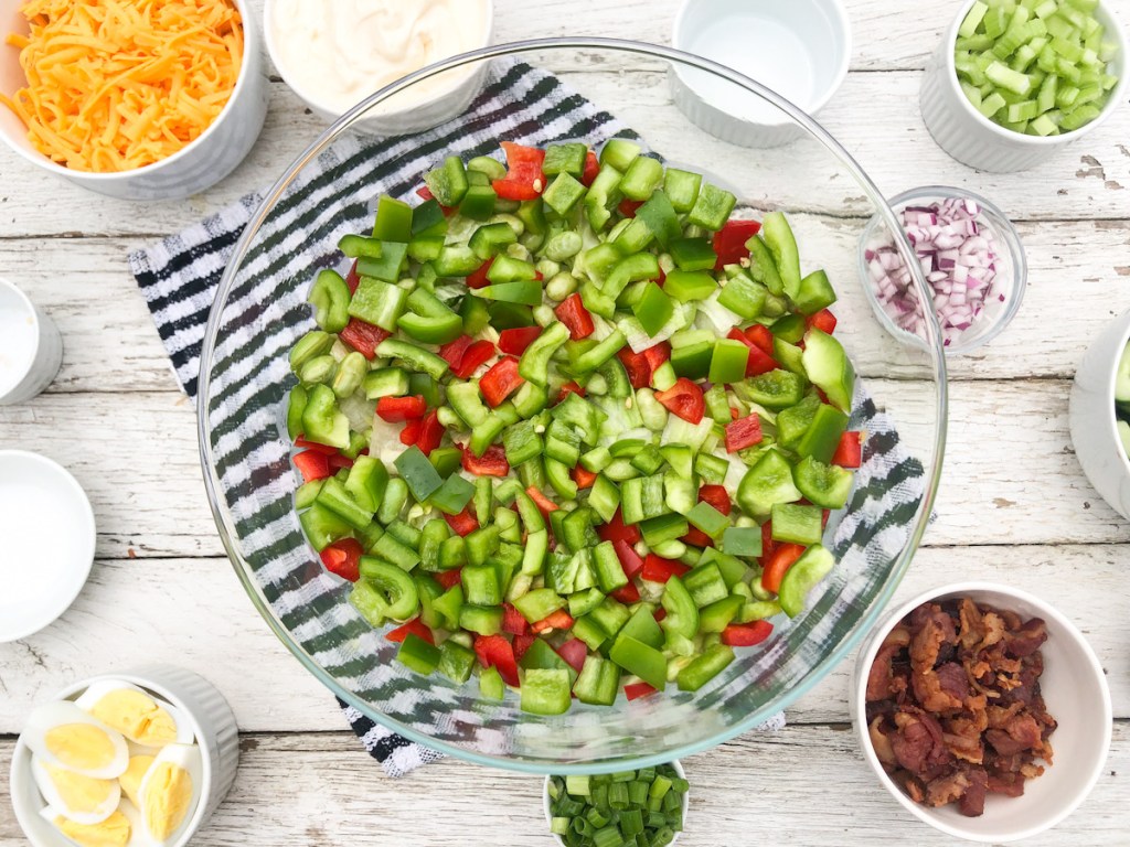 adding chopped bell peppers