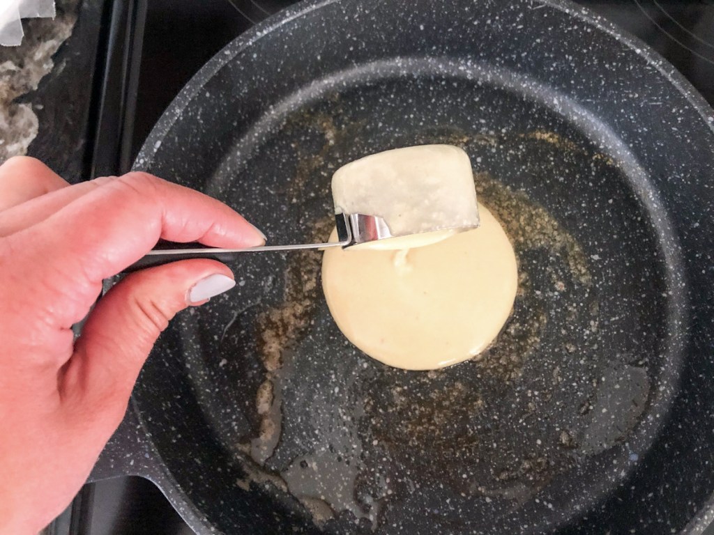 pouring batter into a pan