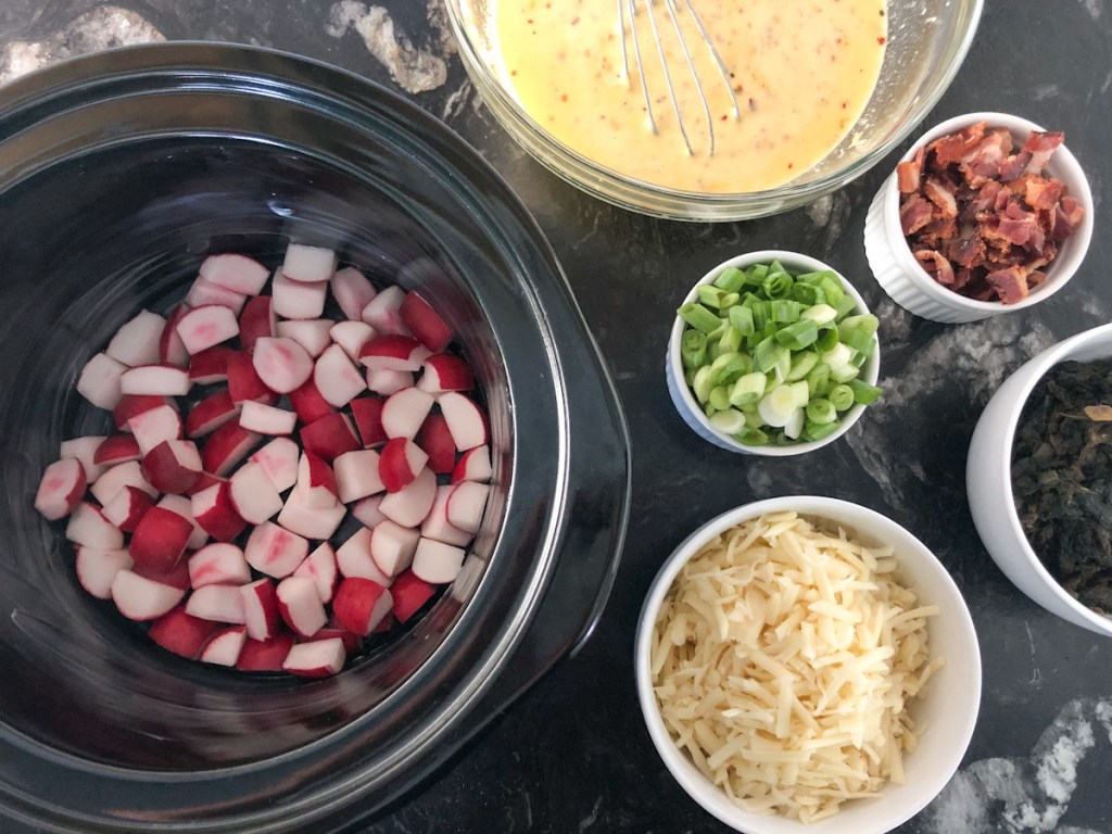 radishes in a crockpot with ingredients around it