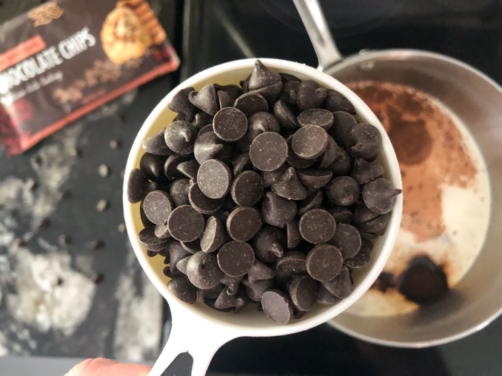 measuring cup full of chocolate chips