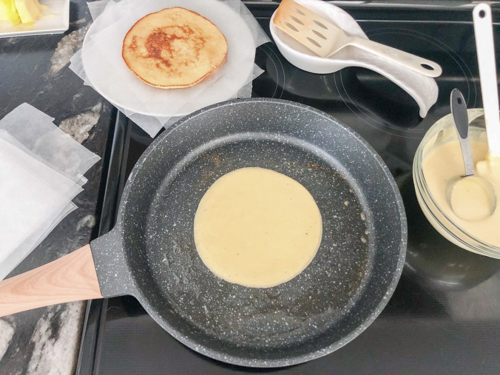 keto crepes cooking in a skillet