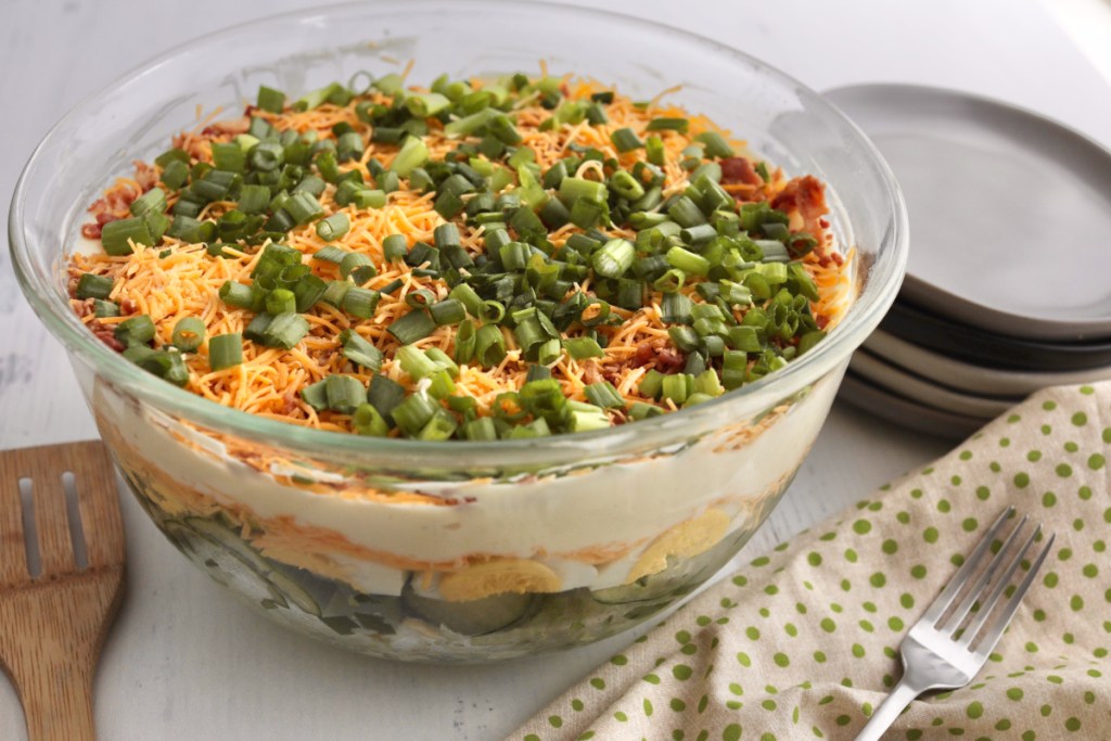 keto 24 hour layered salad in a clear large bowl