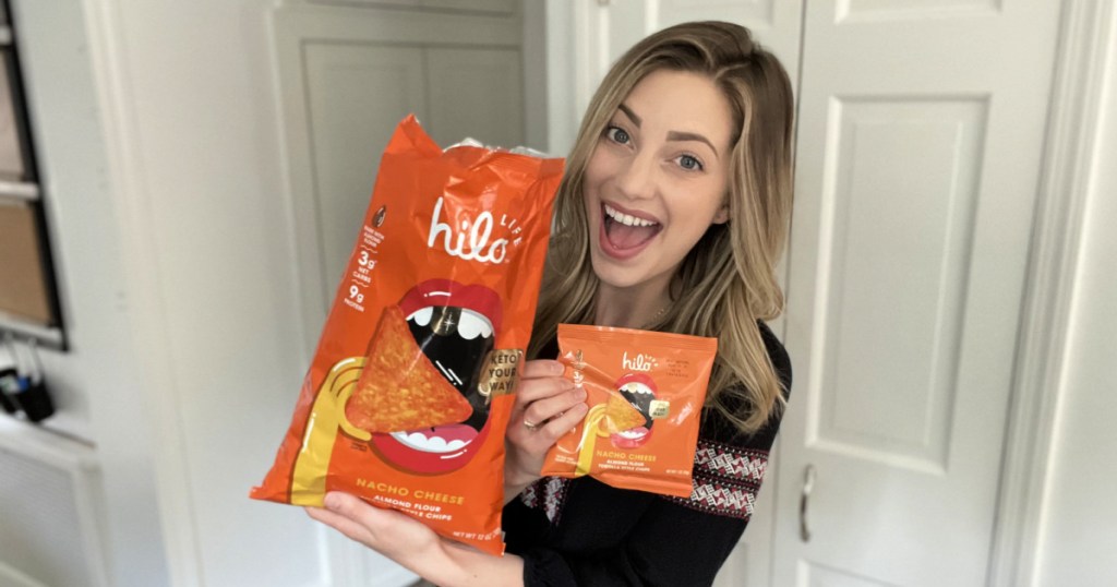 woman holding both sizes of hilo life chips