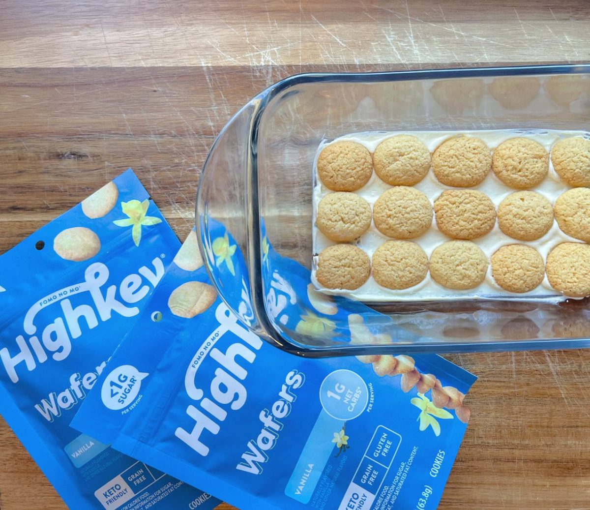 keto cookies on top of eclair cake in glass baking dish