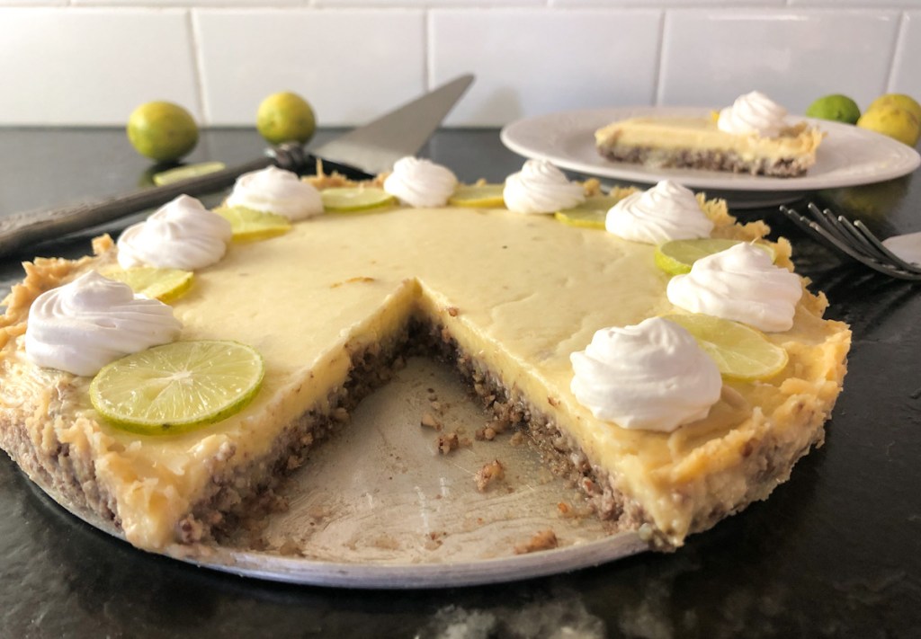 key lime pie with a piece out of it