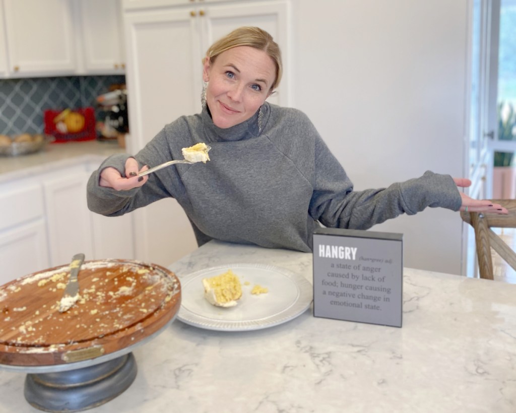 woman pointing at keto cheat food for how to get back into ketosis