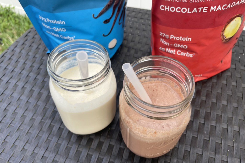 two keto shakes in front of bags on table