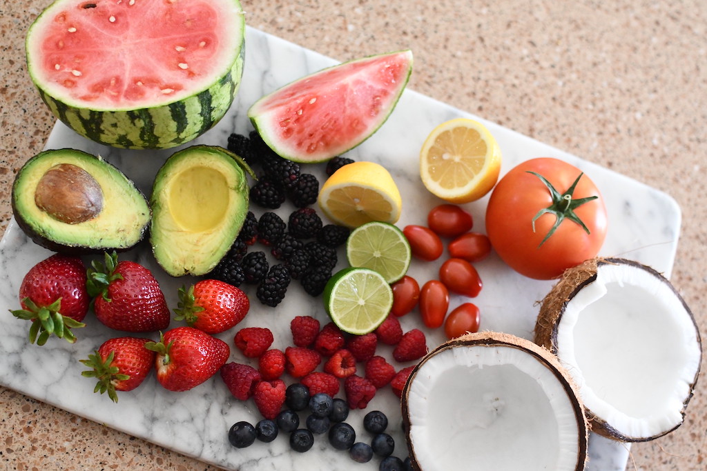 low carb fruits and keto friendly fruits displayed on cutting board 