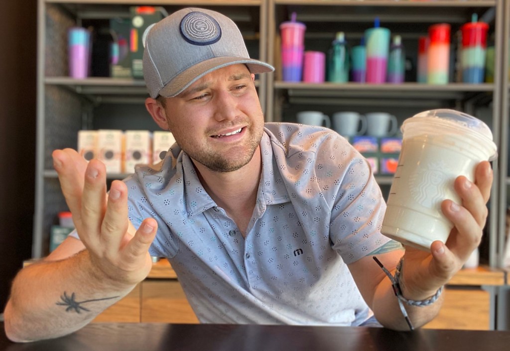 man with drink with no starbucks cinnamon dolce syrup