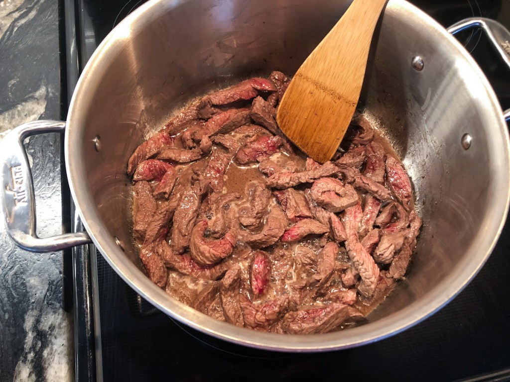 steak seared in a large sauce pan