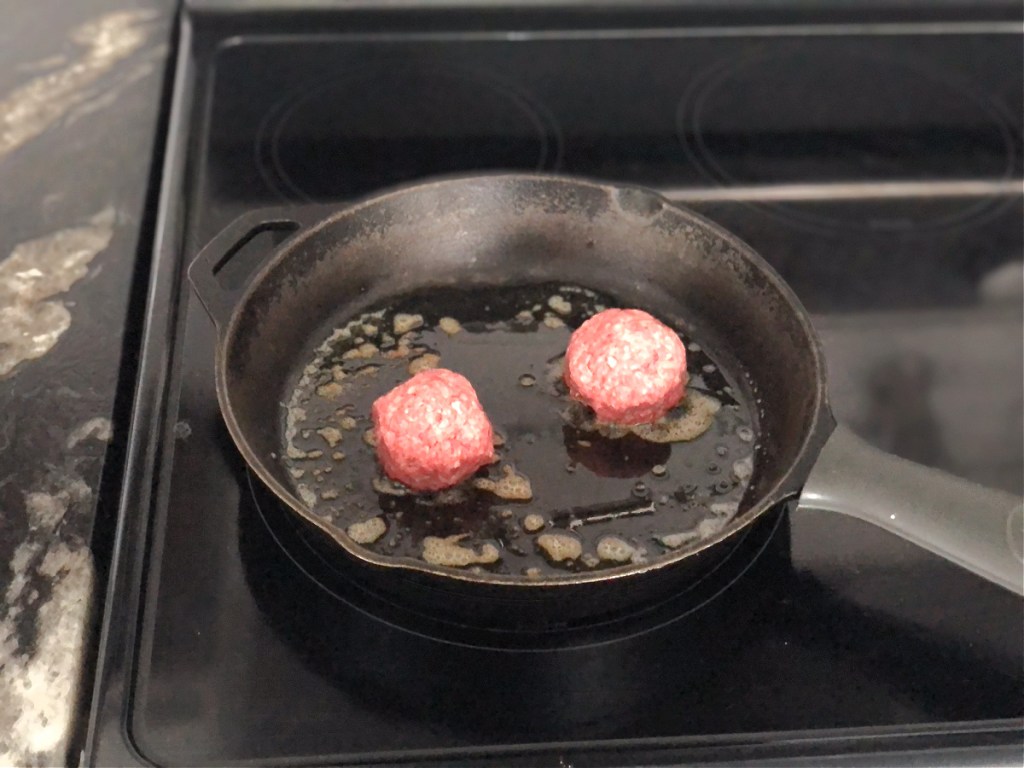 ground beef balls in a skillet