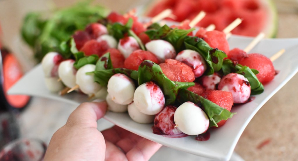 is watermelon keto? It can be if you try these Watermelon Caprese skewers shown here on a serving plate