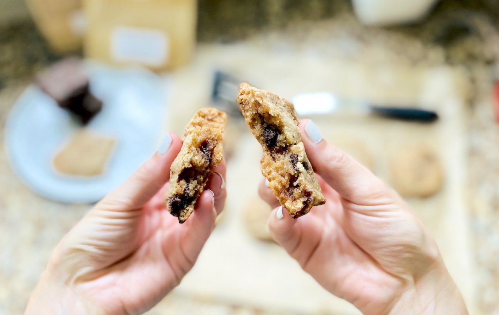 hand pulling apart keto chocolate chip cookie
