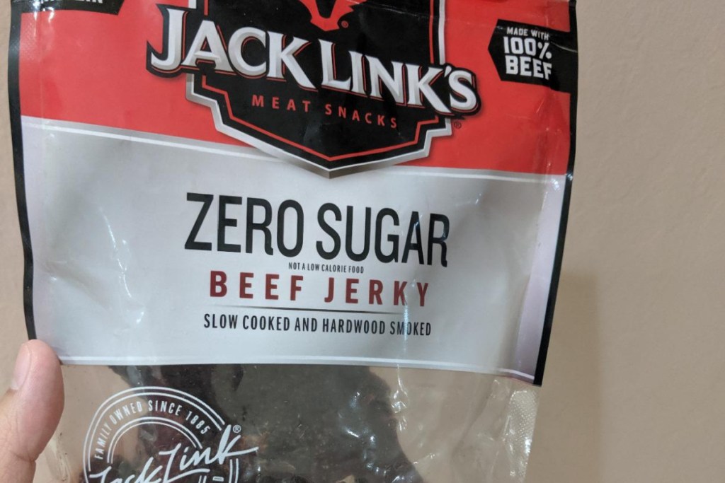 hand holding package of zero sugar beef jerky