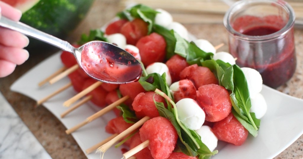 drizzling vinaigrette on caprese