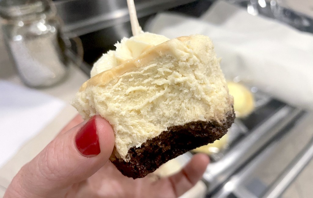 hand holding cheesecake cupcake