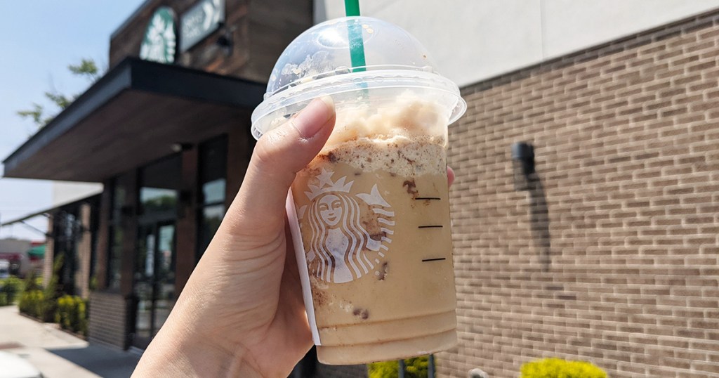 hand holding cinnamon dole keto frappuccino