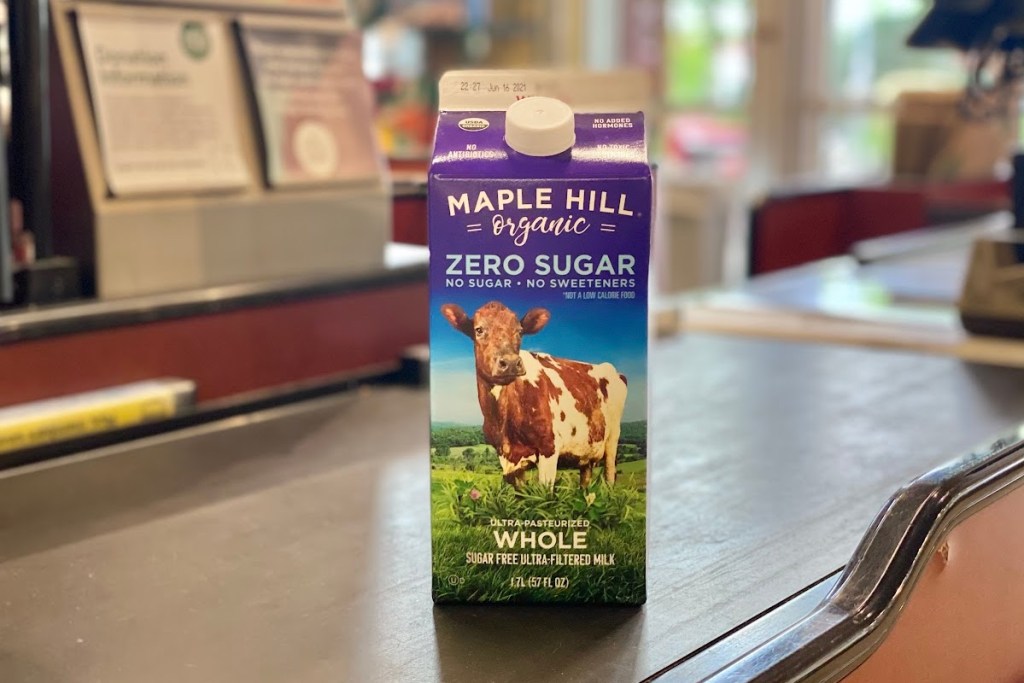 Maple Hill milk carton on store conveyor