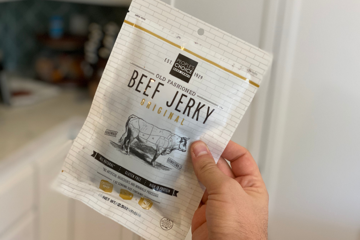 hand holding a people's choice jerky package