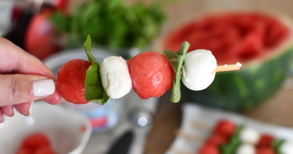 holding watermelon capers skewer 