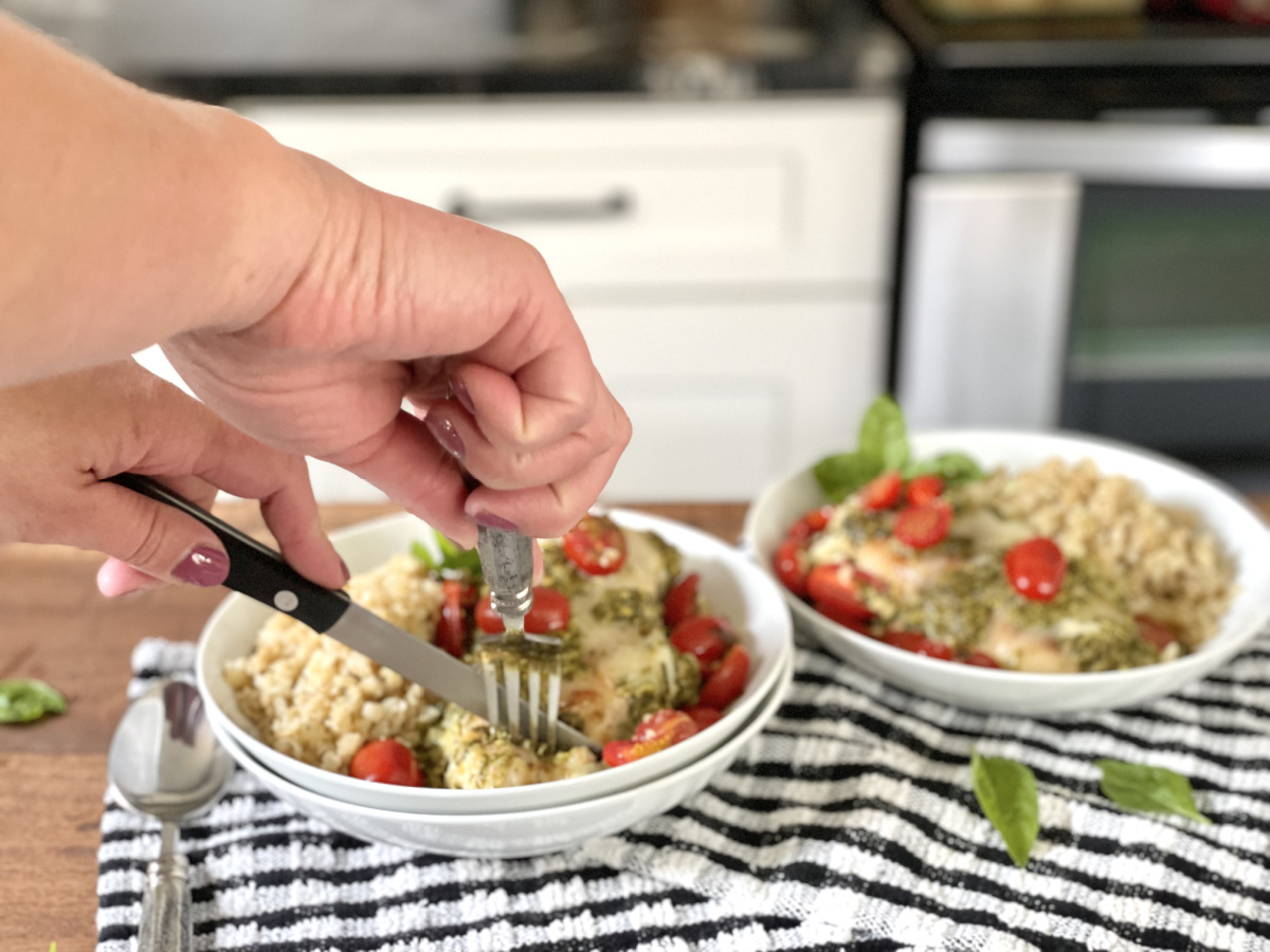 cutting chicken in Grilled Chicken Margherita Olive Garden