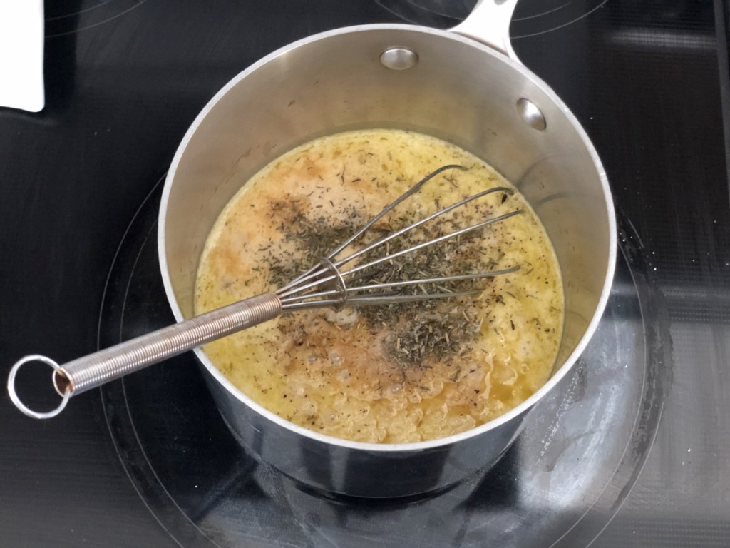 cooking keto gravy in a saucepan