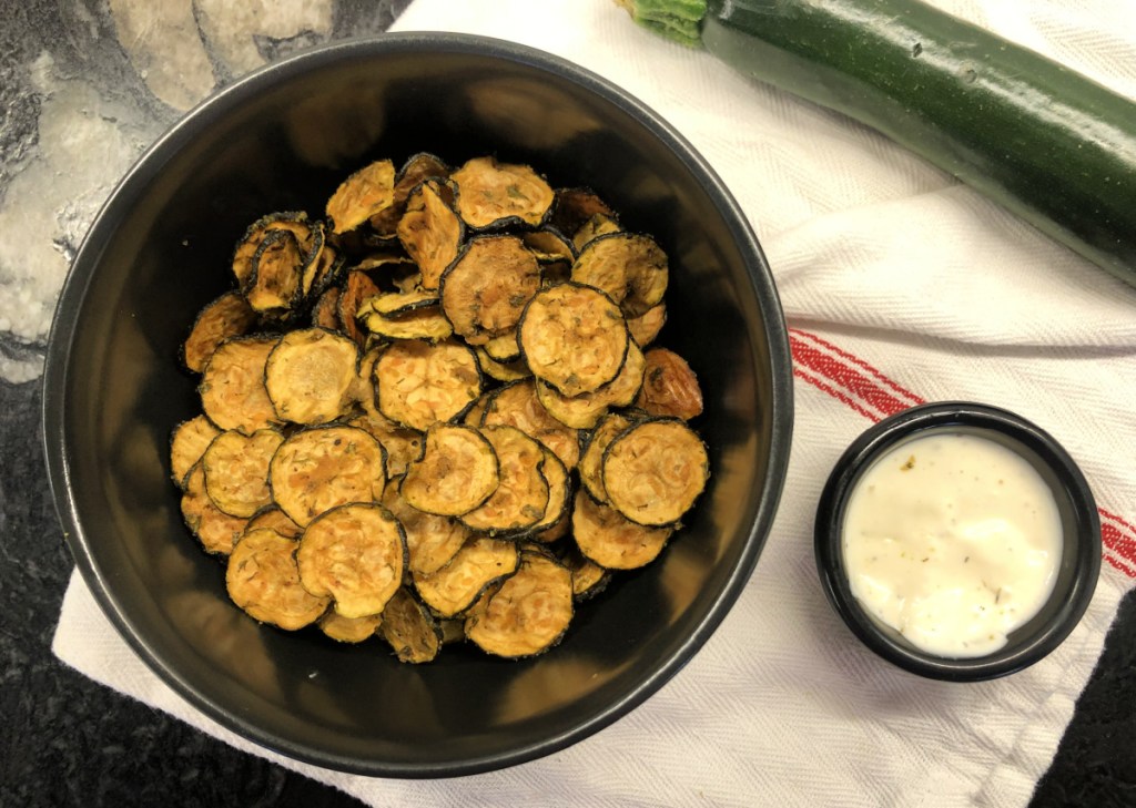 Keto Zucchini Chips next to a ranch dip