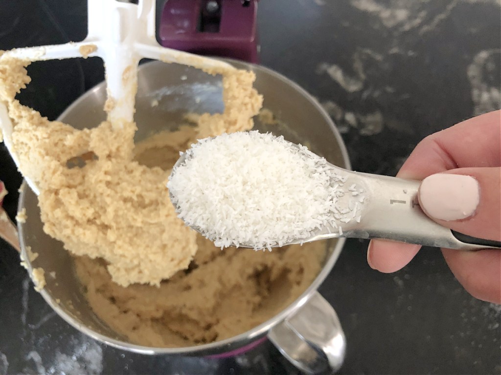 adding coconut to keto coconut cake batter