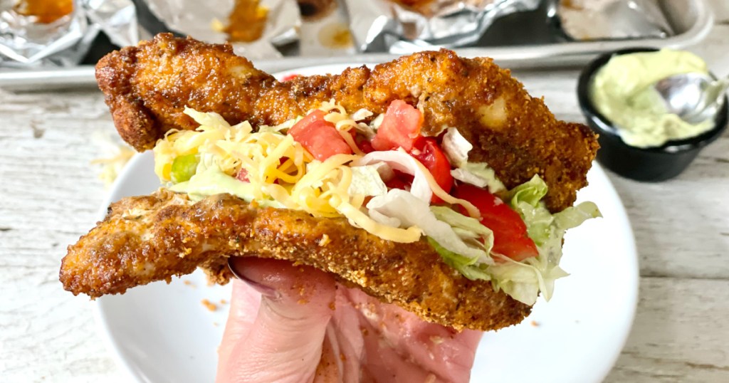 Naked Chicken Chalupa holding
