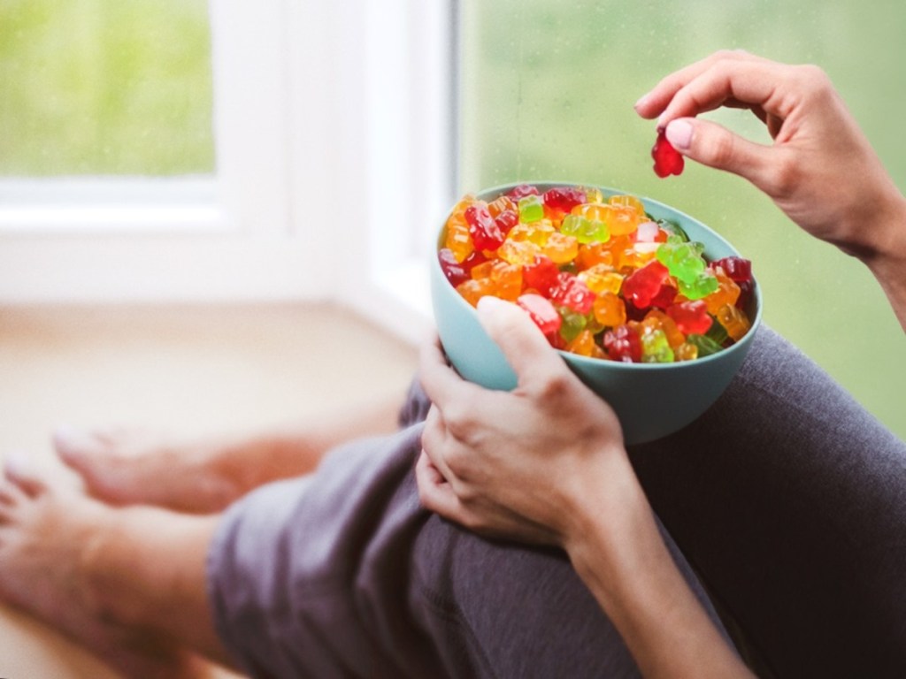 eating from a bowl of gummy bears