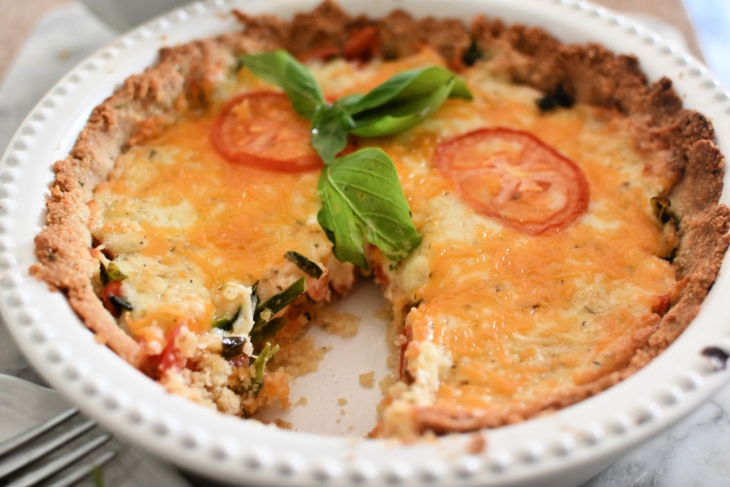 baked tomato pie with a slice cut out 