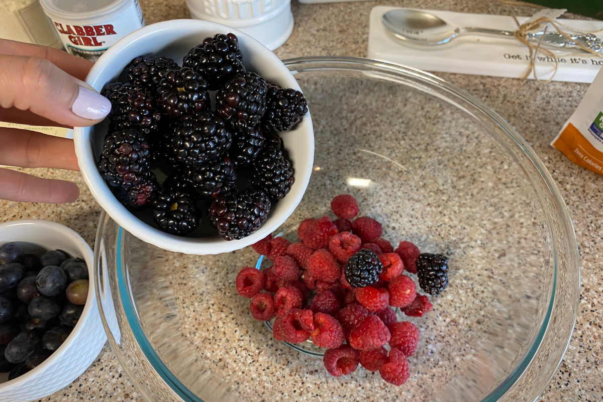 pouring berries into bowl