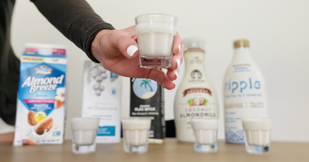 hand holding shot glass full of dairy free keto milk