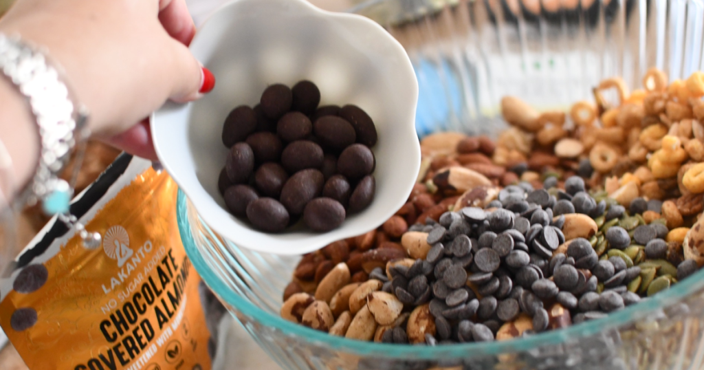 putting keto trail mix in bowl