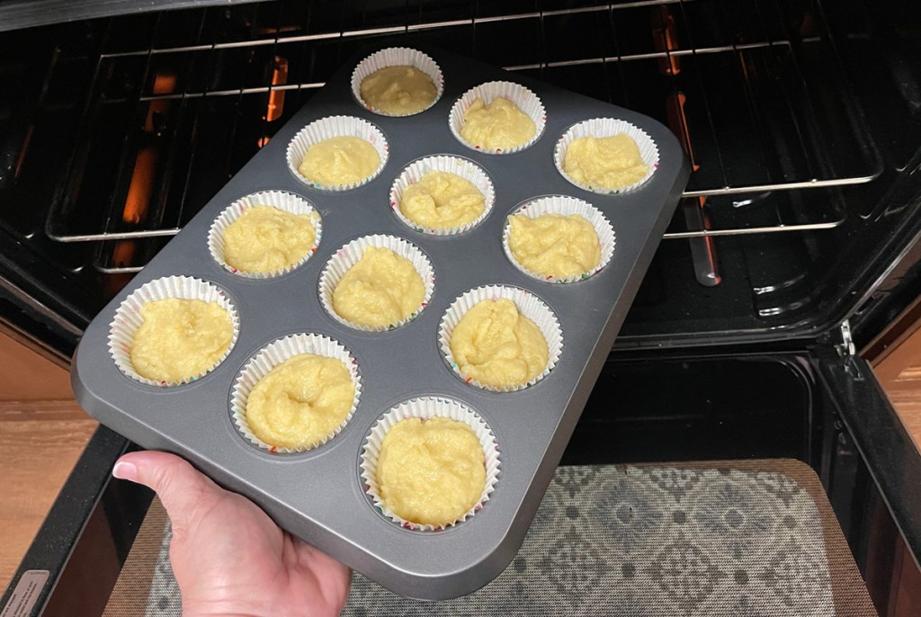 putting cupcakes in the oven