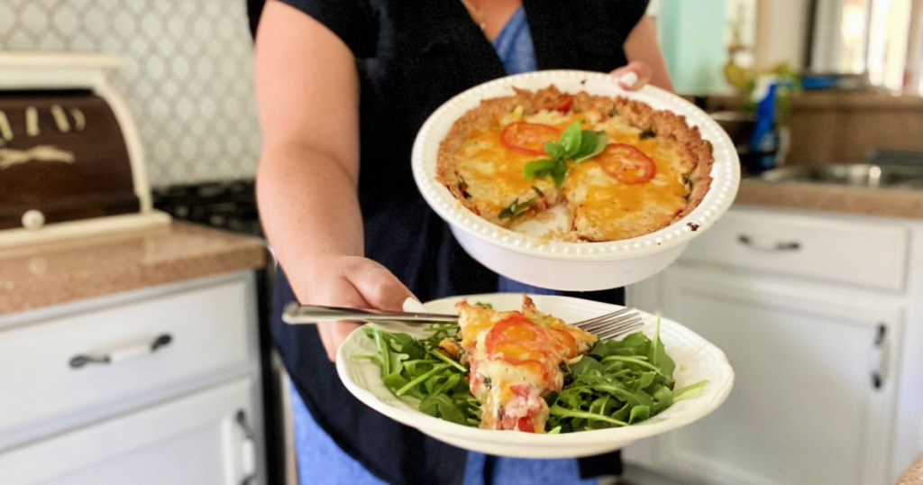 woman holding keto tomato pie