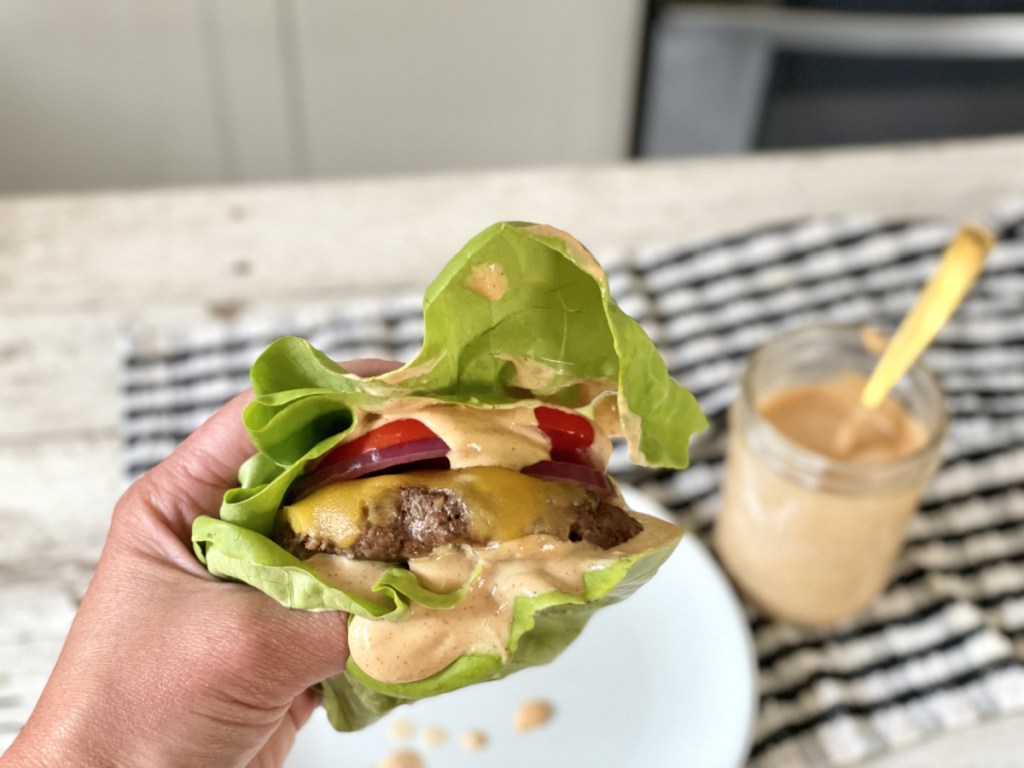 holding a burger with Burger Sauce Recipe