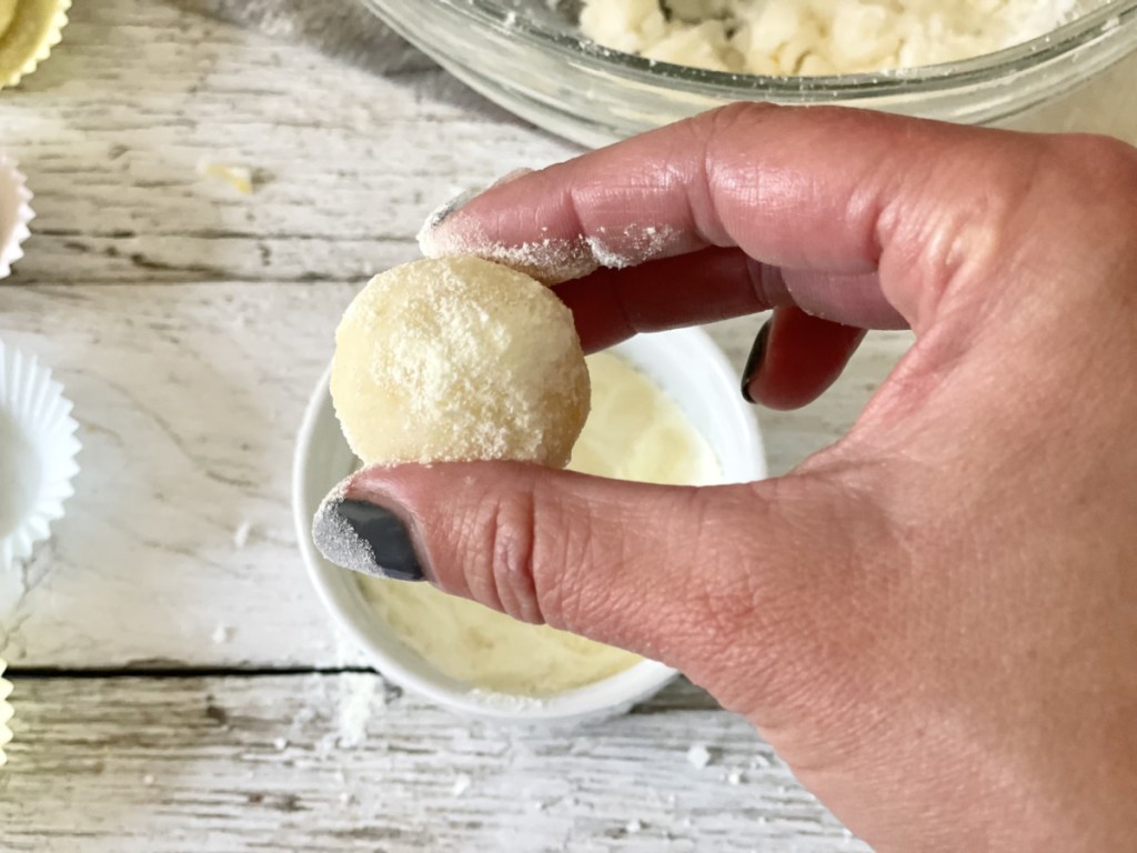 holding coated keto lemon fat bombs 